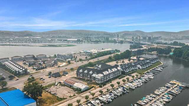 drone / aerial view with a water and mountain view