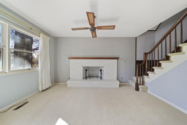 unfurnished living room with carpet flooring and ceiling fan