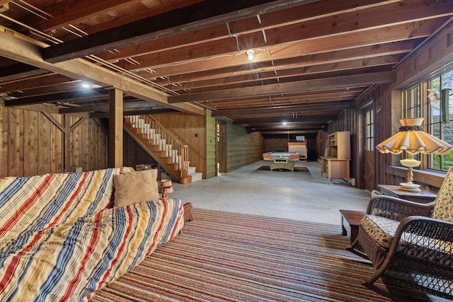 basement featuring wood walls