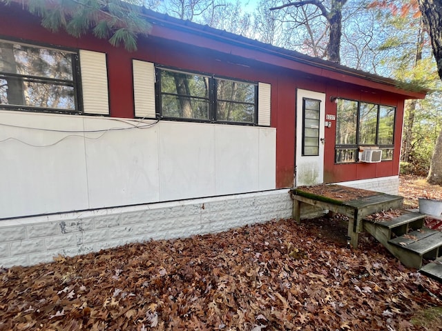 view of side of property featuring cooling unit