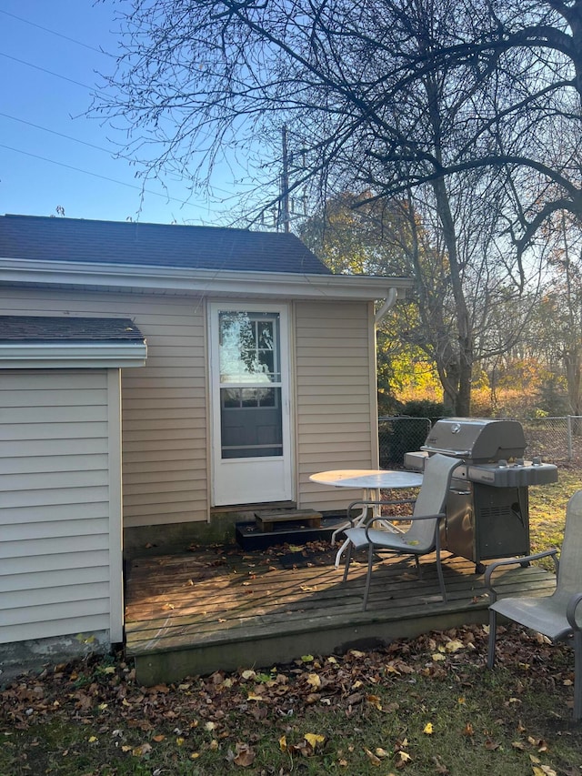 exterior space with a wooden deck and grilling area