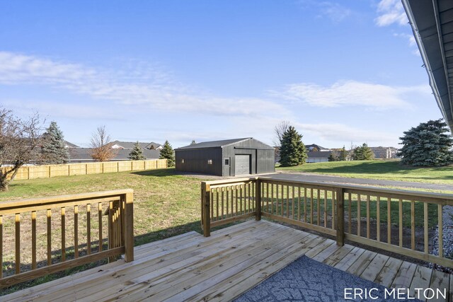 wooden terrace with a yard and a storage shed