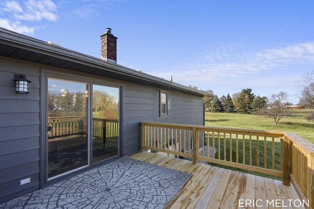 wooden terrace with a yard