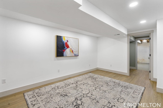 basement featuring light hardwood / wood-style flooring