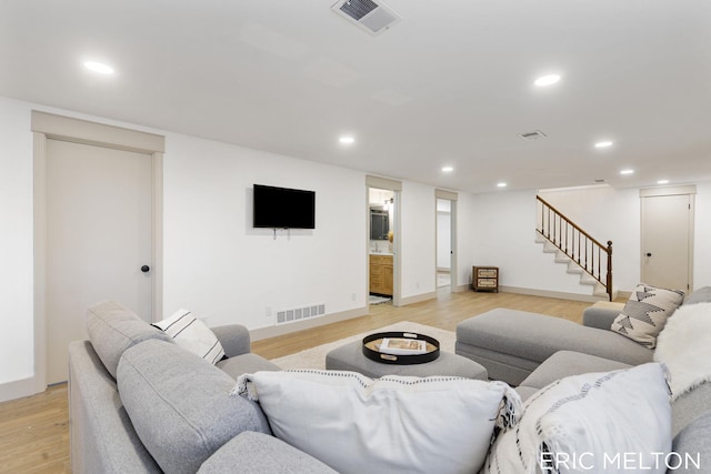 living room with light hardwood / wood-style floors