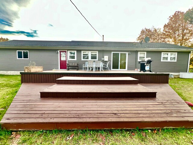 back of house with a wooden deck