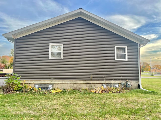 view of property exterior featuring a yard