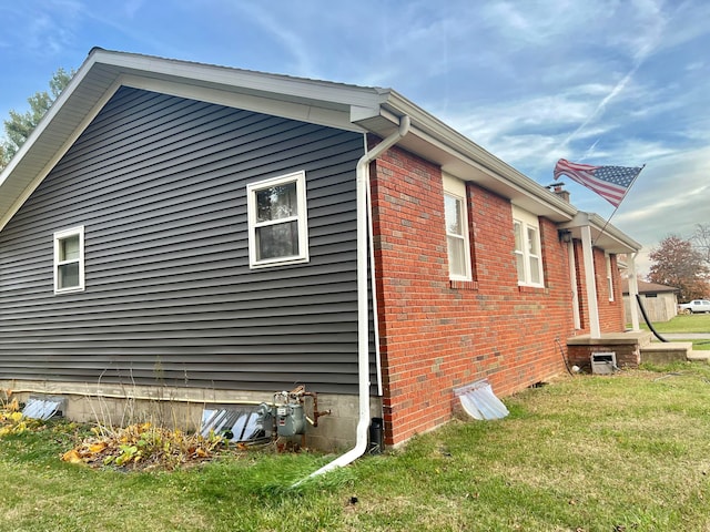 view of home's exterior featuring a yard