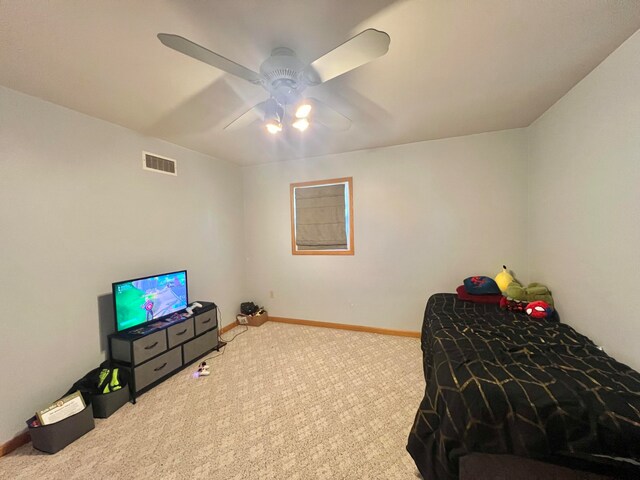 carpeted bedroom with ceiling fan