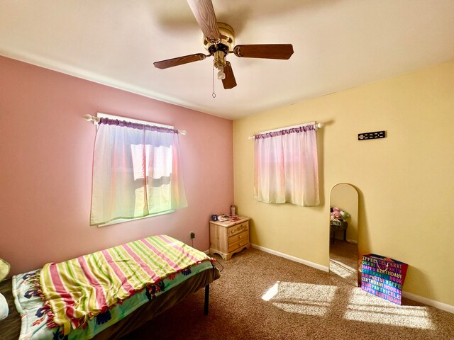 carpeted bedroom with ceiling fan