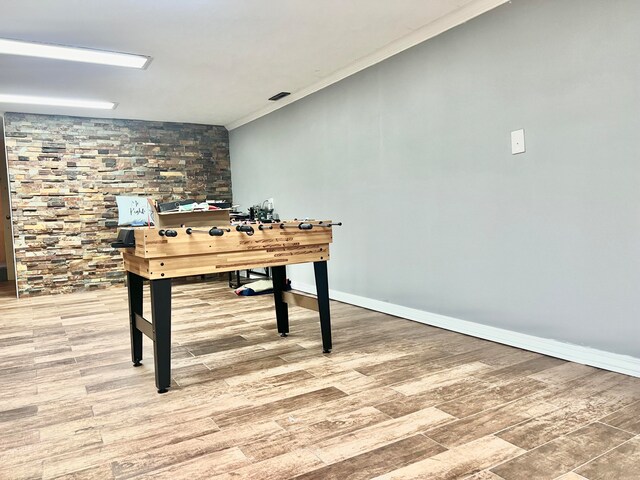 unfurnished office featuring crown molding and wood-type flooring