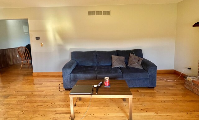 living room with light hardwood / wood-style flooring