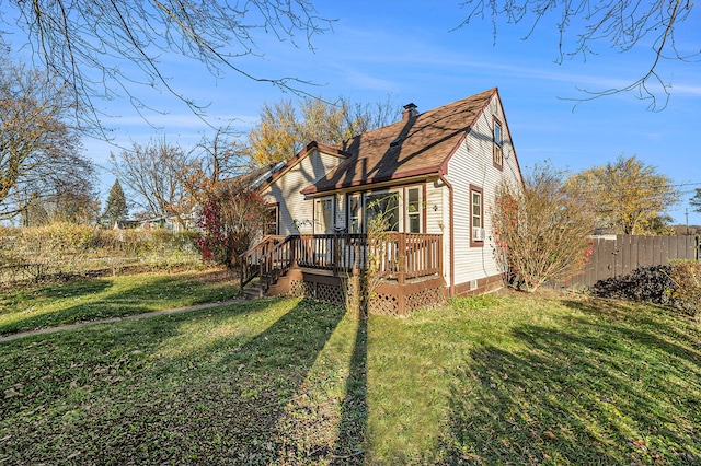 exterior space with a lawn and a deck