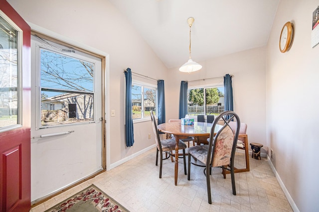 dining room with vaulted ceiling