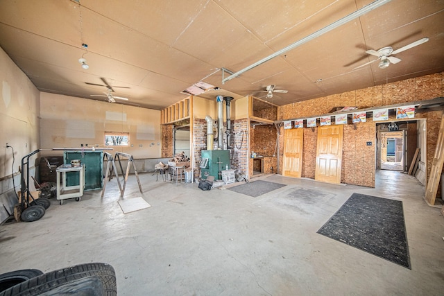 miscellaneous room featuring concrete floors and ceiling fan