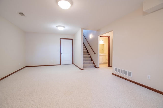 unfurnished room with light carpet