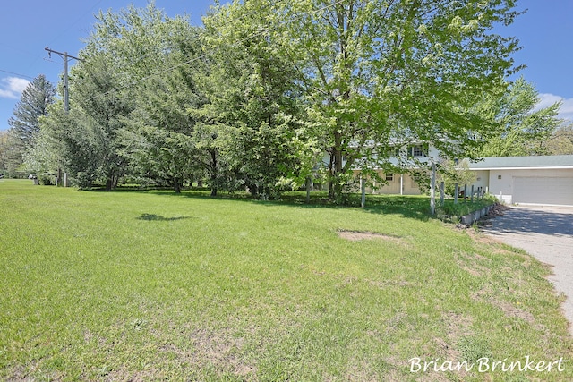 view of yard with a garage