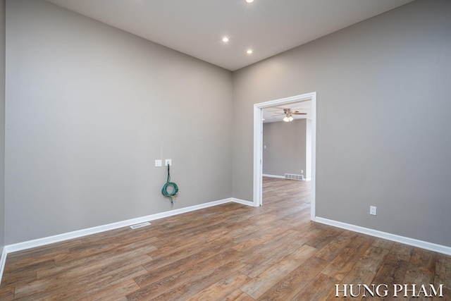 unfurnished room featuring hardwood / wood-style floors and ceiling fan