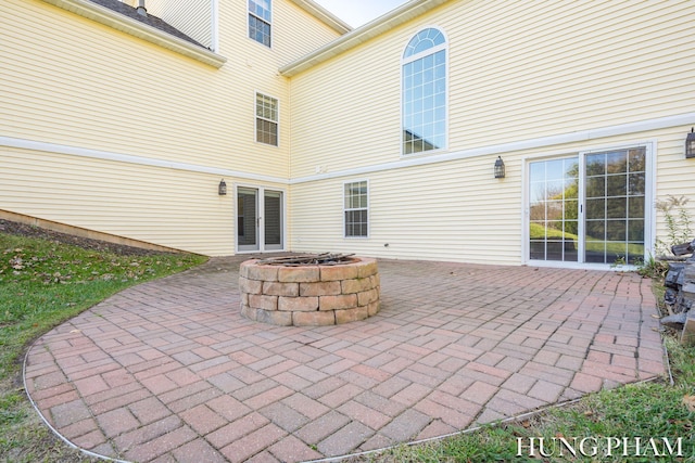 view of patio / terrace featuring an outdoor fire pit