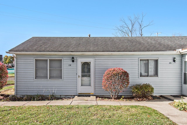 ranch-style house with a front lawn