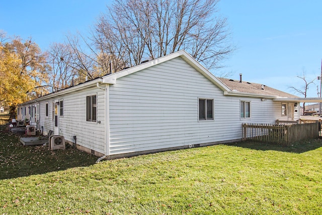 view of side of property featuring a yard