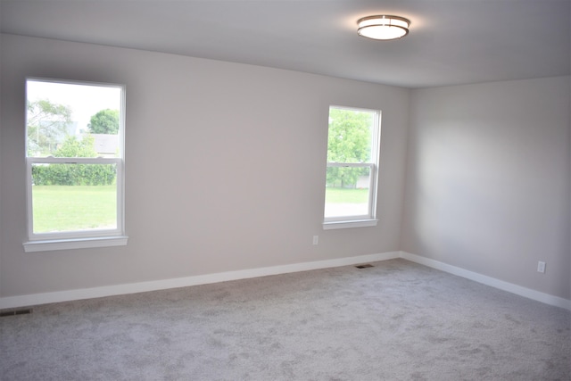 unfurnished room featuring carpet flooring