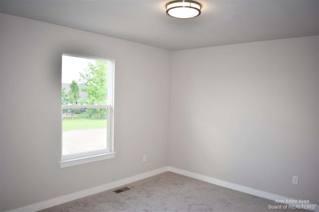 empty room featuring carpet floors