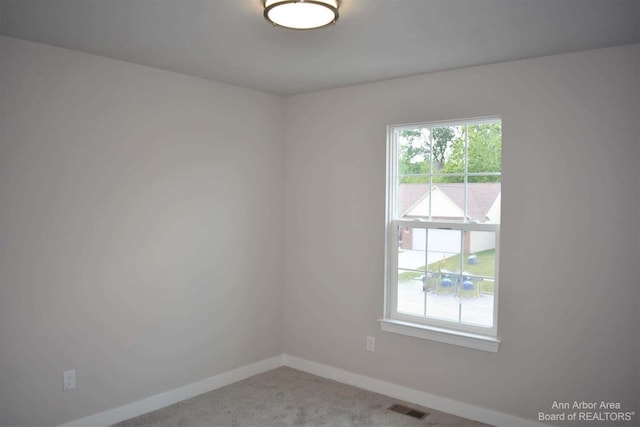 empty room featuring carpet floors