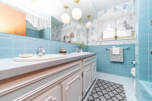 bathroom featuring tile walls, tile patterned flooring, vanity, and toilet