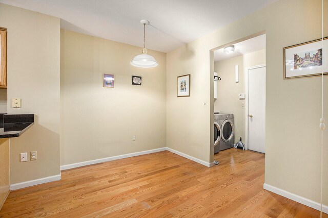 interior space with light wood-type flooring and washer and dryer