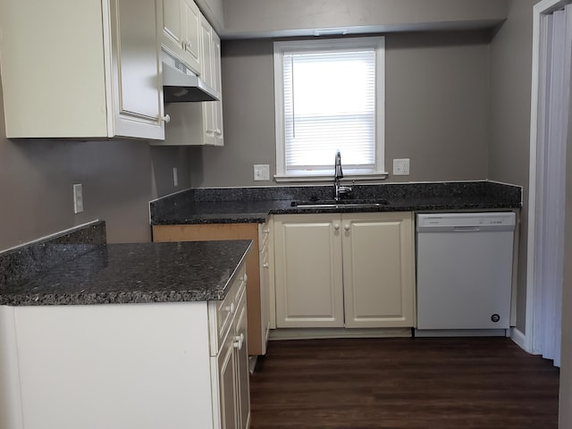 kitchen with sink, dark stone counters, white cabinets, dishwasher, and dark hardwood / wood-style flooring