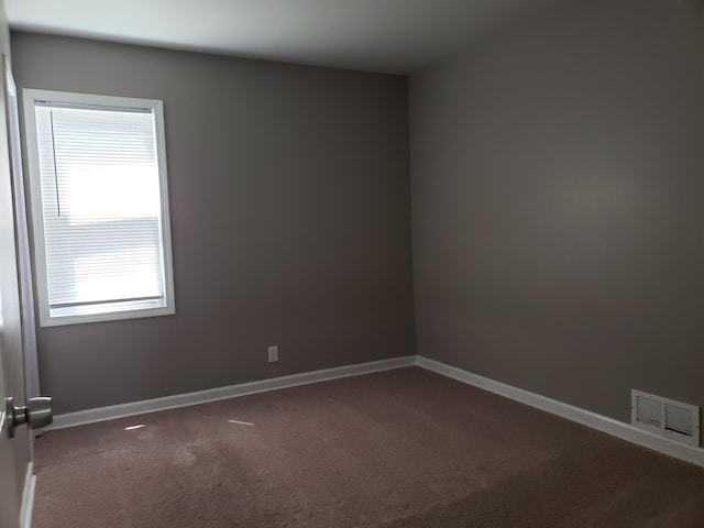 empty room with carpet flooring