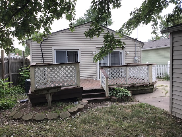 rear view of property with a wooden deck