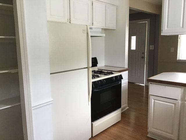 kitchen with white cabinets, dark hardwood / wood-style floors, white appliances, and ventilation hood