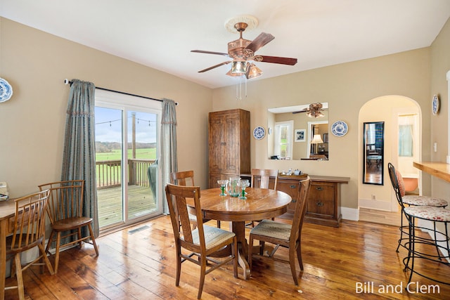 dining area featuring ceiling fan and wood-type flooring