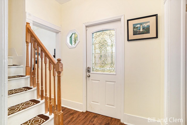 entryway with dark wood-type flooring