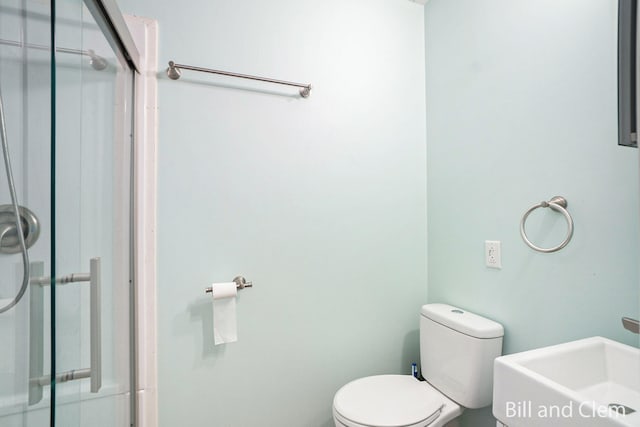 bathroom featuring sink and toilet