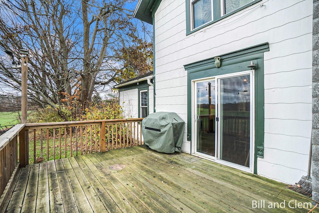 wooden terrace featuring grilling area