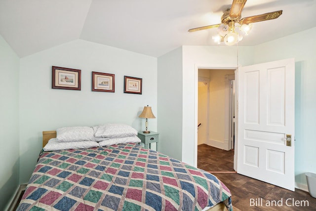 bedroom featuring ceiling fan, dark hardwood / wood-style flooring, and lofted ceiling