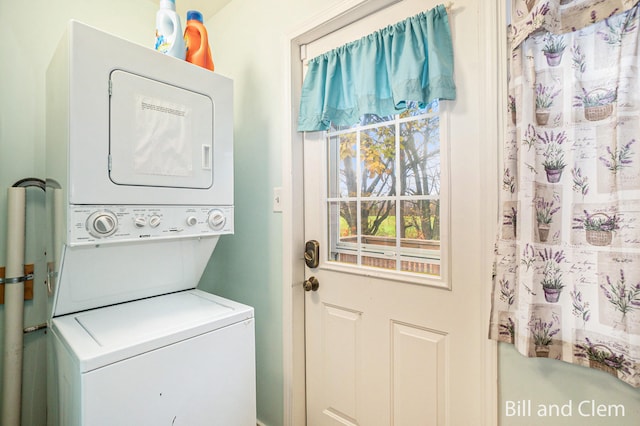 washroom with stacked washer and dryer