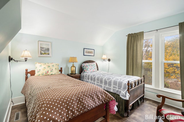 bedroom featuring lofted ceiling