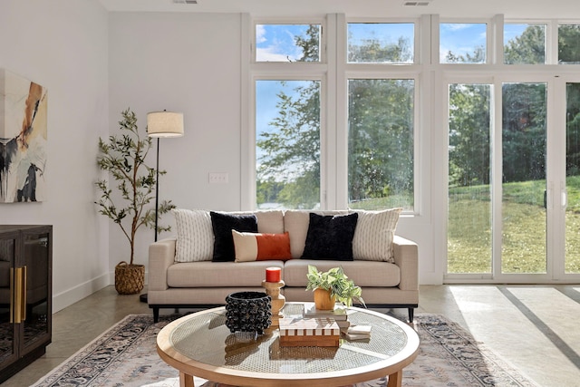 living room with concrete flooring