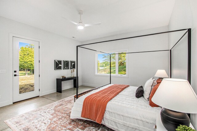 bedroom featuring access to outside, multiple windows, and ceiling fan