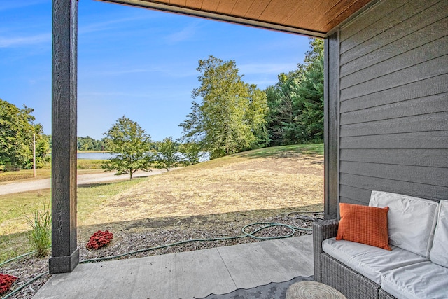 view of patio featuring a water view