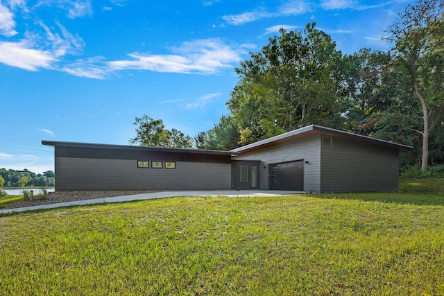 exterior space with a water view and a front lawn