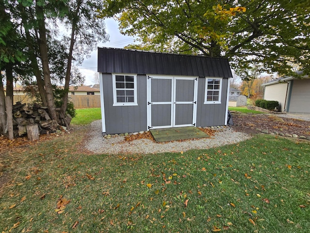 view of outdoor structure with a lawn