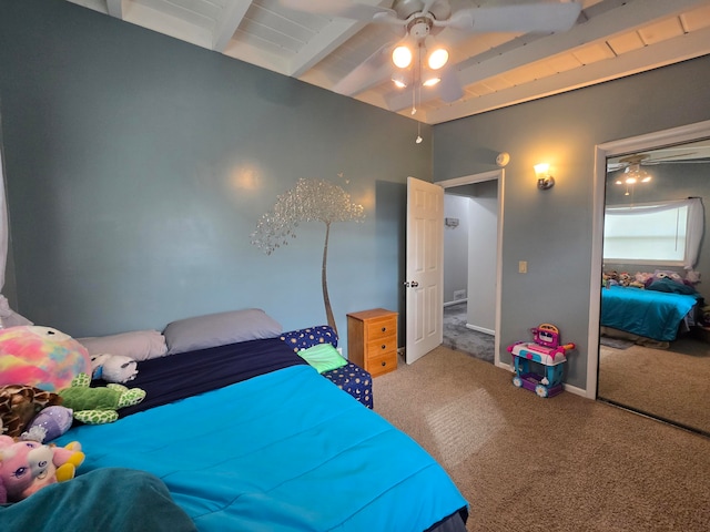 bedroom with carpet flooring, ceiling fan, and beam ceiling