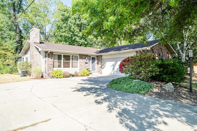 ranch-style house featuring a garage