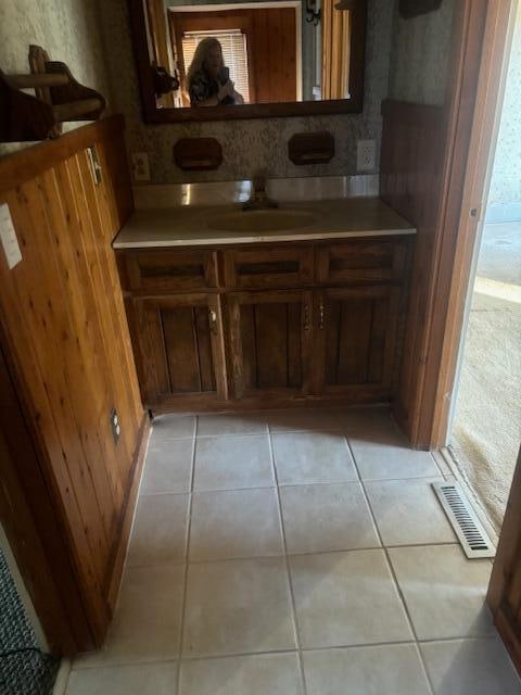 bathroom with vanity and tile patterned flooring