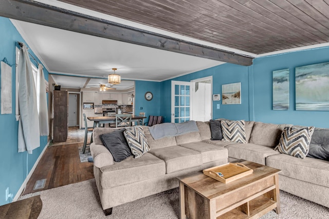 living room with ornamental molding, wood-type flooring, ceiling fan, and wood ceiling